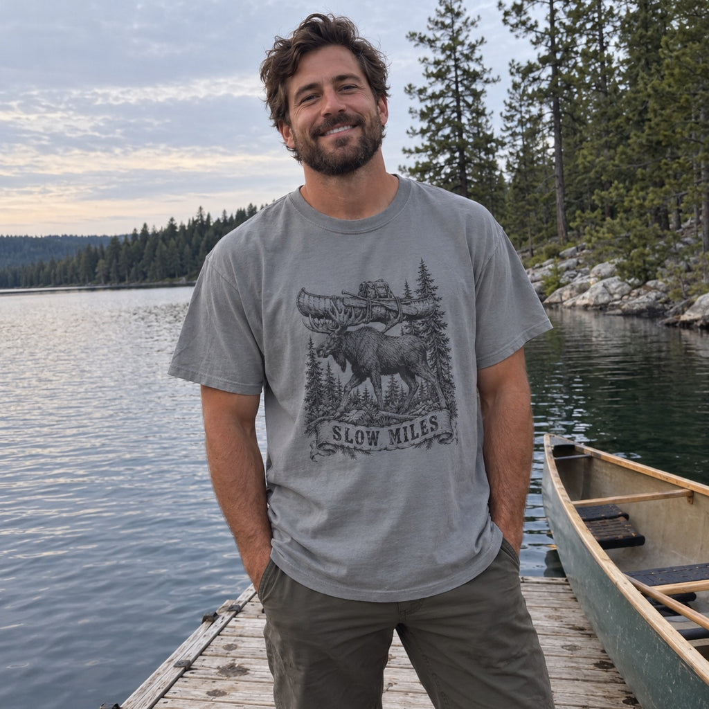 Slow Miles T-Shirt worn at a lake dock