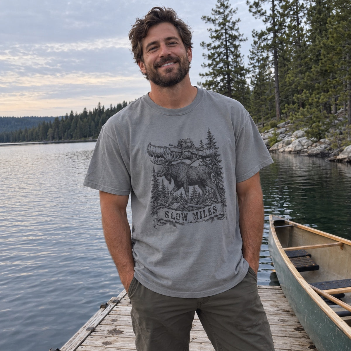 Slow Miles T-Shirt worn at a lake dock