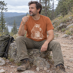 Hiker wearing the Snack Thief Bear T-Shirt