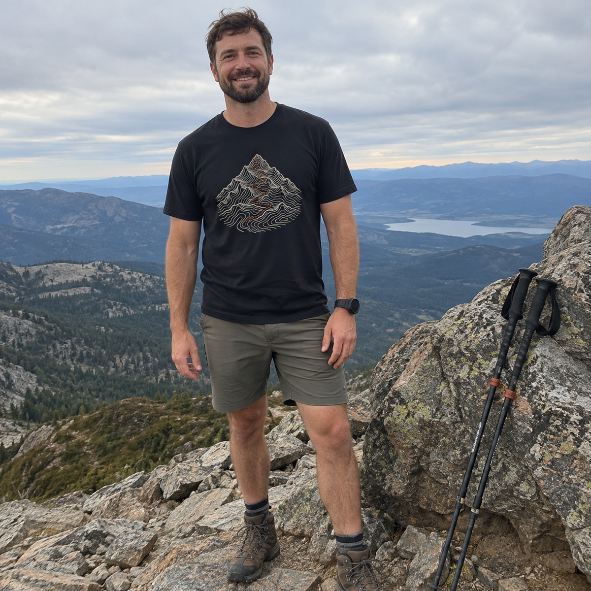 Man wearing the Summit Trail T-Shirt on a mountain summit