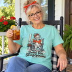 Woman wearing the Sweet Tea, Strong Opinions T-Shirt on a porch