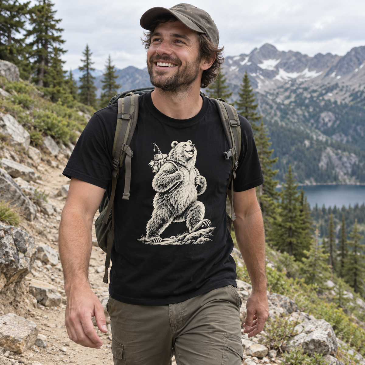 Hiker on a mountain trail wearing the Tiny Backpack Grizzly T-Shirt