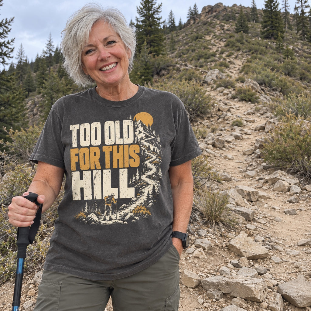 Woman wearing the Too Old for This Hill T-Shirt at the bottom of a steep trail