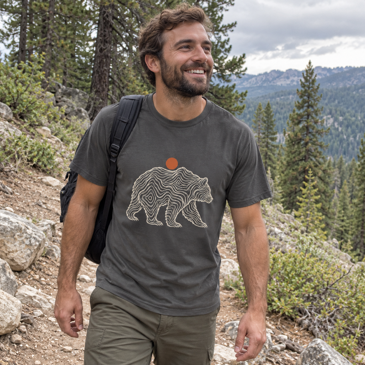 Man wearing the Topo Bear T-Shirt on a mountain trail
