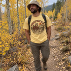 Man in a bucket hat wearing the Turkey Trail Club T-Shirt on an aspen trail