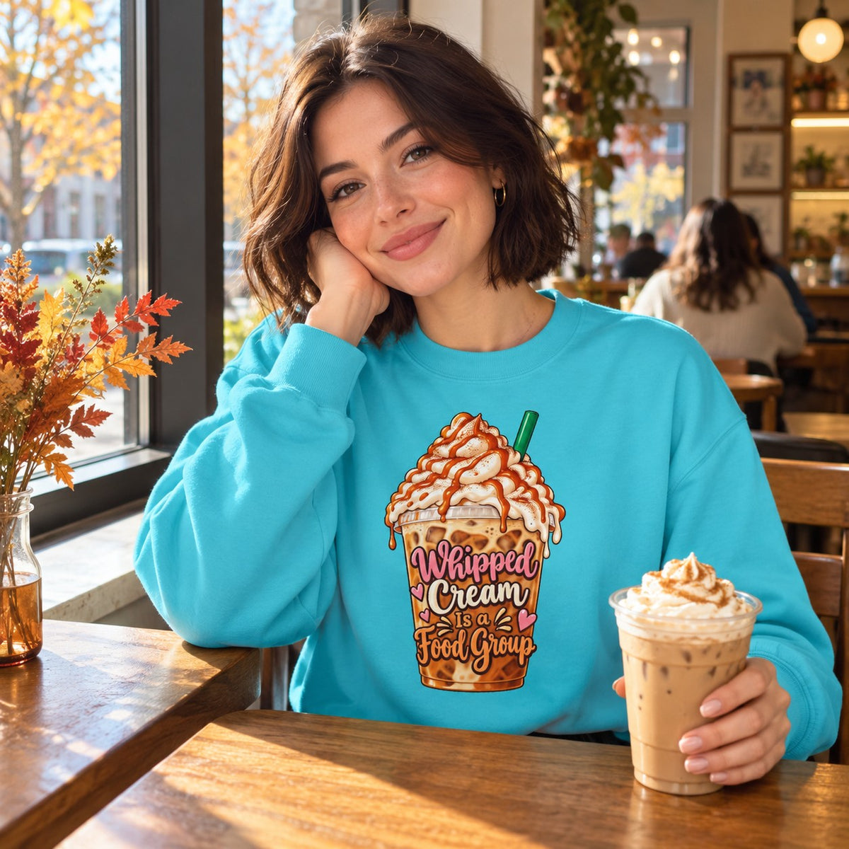 Woman wearing the Whipped Cream Is a Food Group sweatshirt