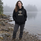 Woman wearing the No Wi-Fi, Better Connection hoodie on a misty lakeshore in the morning