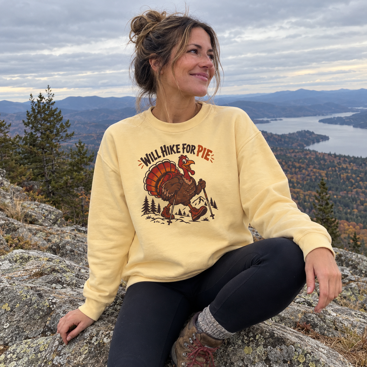 Woman wearing the Will Hike for Pie Sweatshirt at a mountain overlook